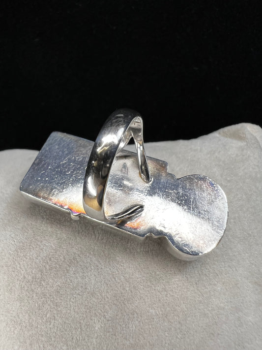 Crafted from sterling silver and set with three natural stones, this ring will certainly make a statement. There is a natural inclusion on the moonstone.