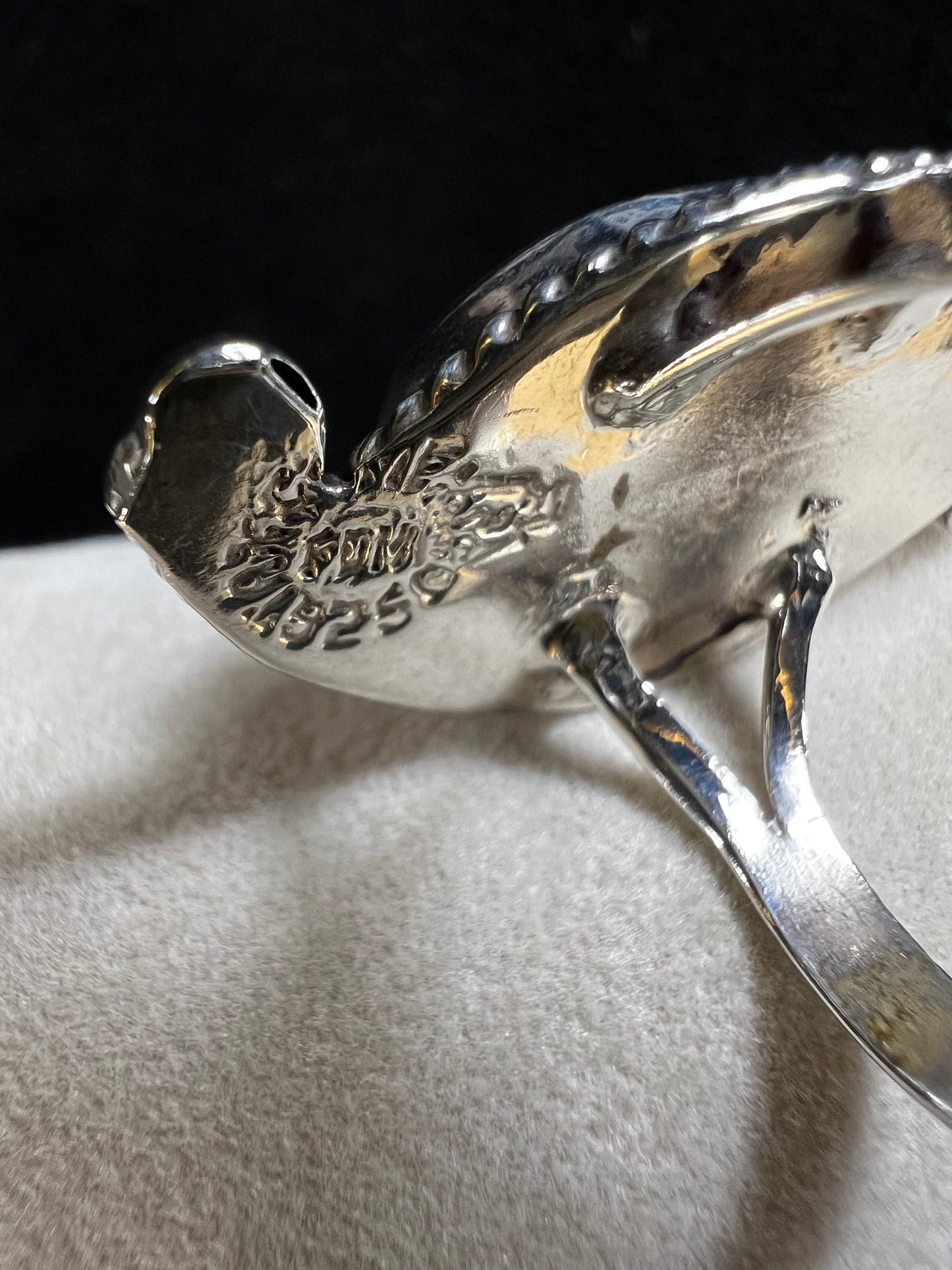 This vintage Taxco ring is a great find. The ring is crafted from sterling silver and showcases a beautiful piece of abalone, which is nestled in a bed of rope silver and small silver rounds that look like little pearls.