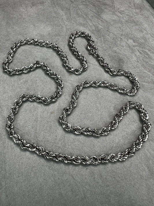 The classic rope chain, made of sterling silver, can be worn alone or paired with a pendant.