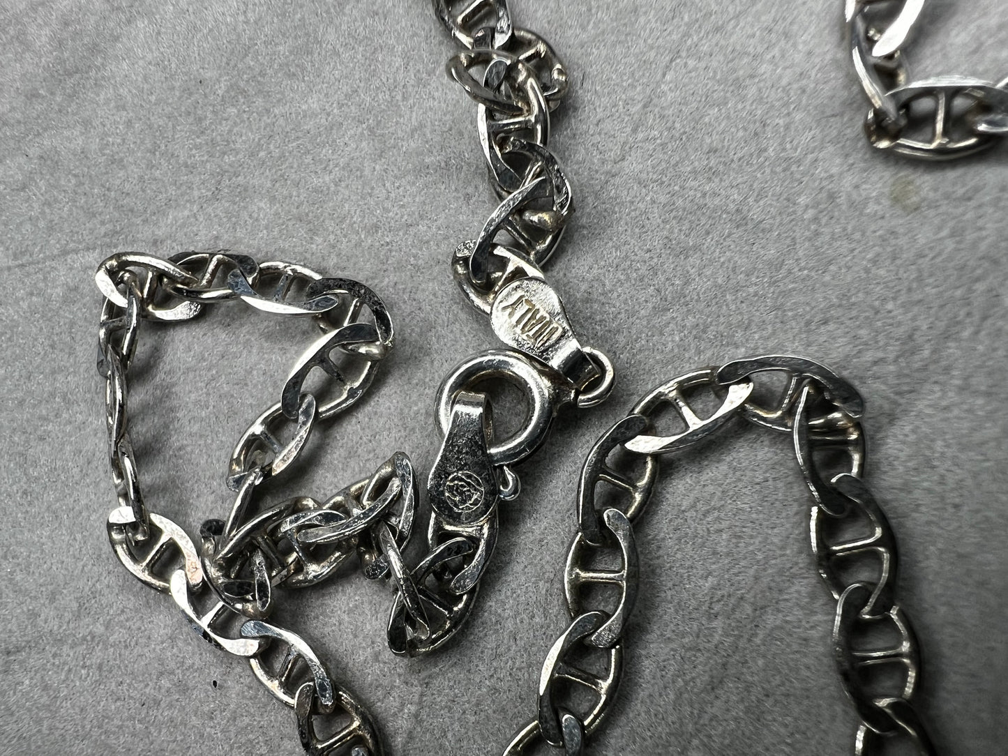 This sterling silver chain necklace features a mariner link and is perfect on its own or paired with one of our pendants.