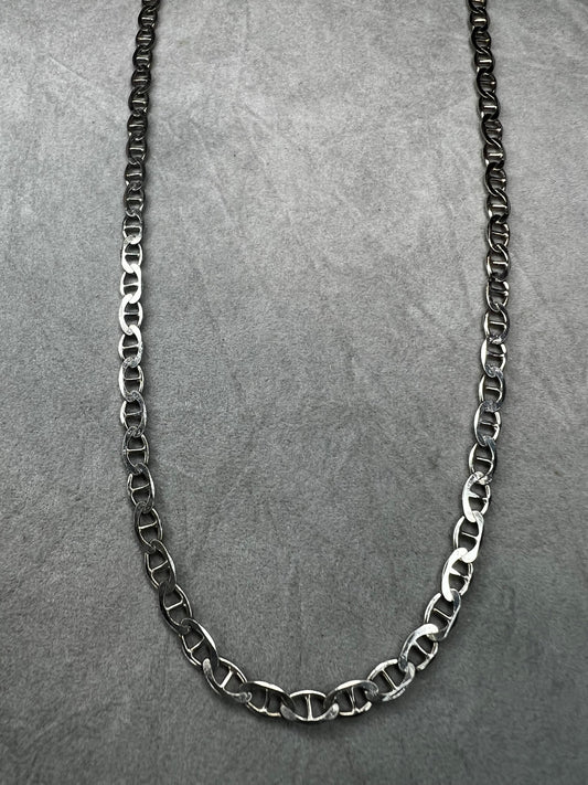 This sterling silver chain necklace features a mariner link and is perfect on its own or paired with one of our pendants.