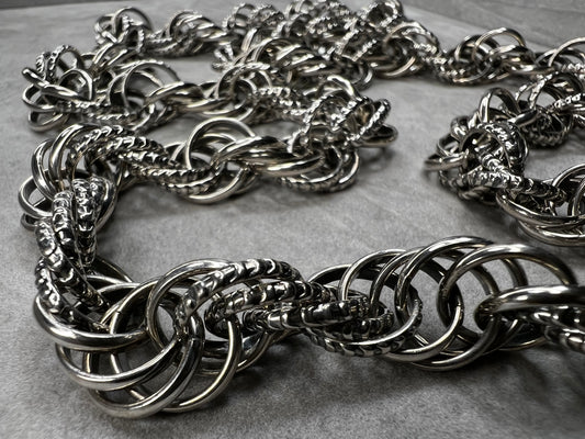 Large enough to fit over your head, this chain has no clasp -- ensuring a long-lasting piece of jewelry. It is a solid, heavy, well-made and detailed chain.