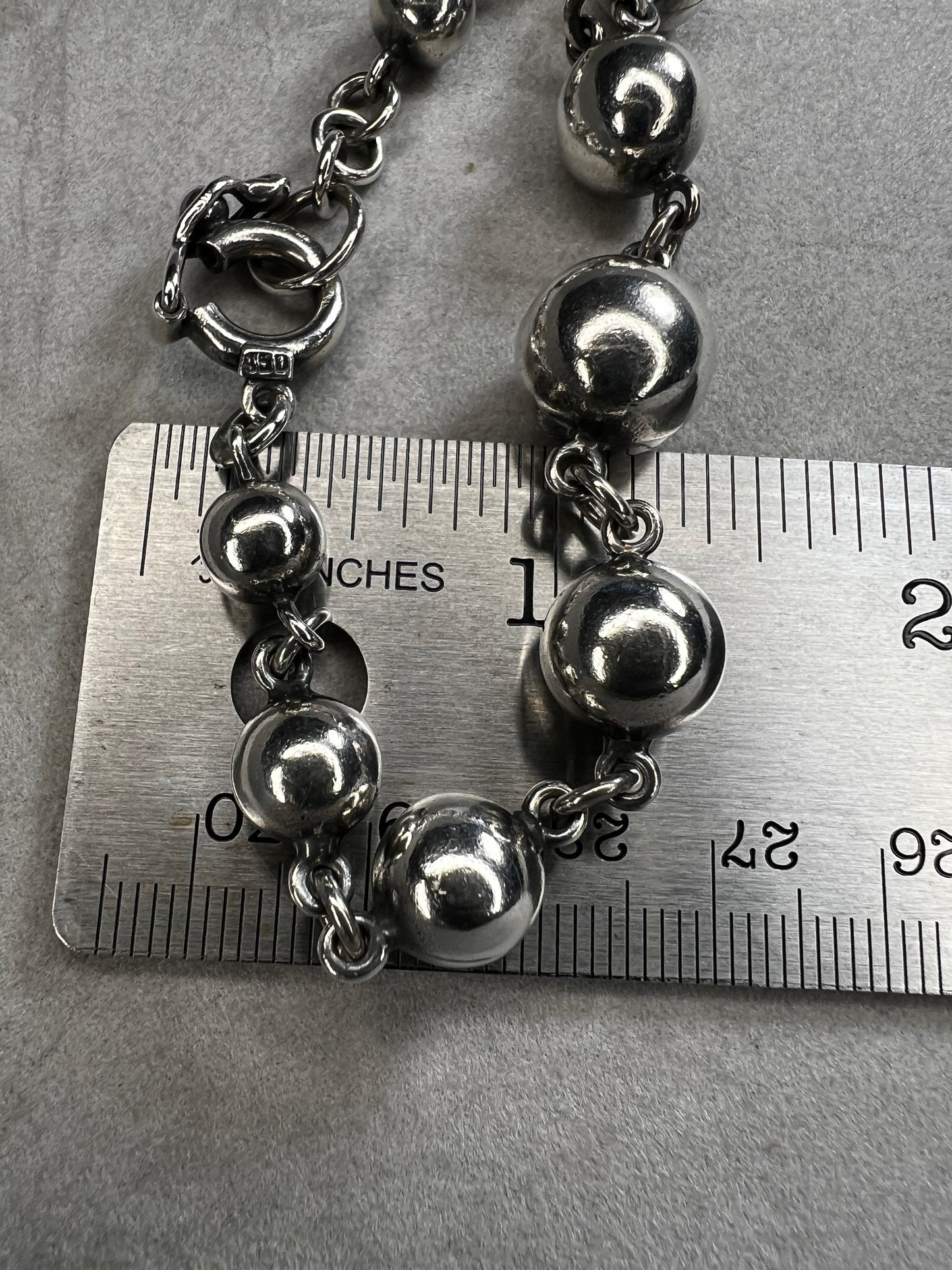 Crafted from 950 fine silver, this vintage ball and link bracelet features a secure locking clasp, reflecting the careful attention to detail during its creation. Its timeless design and durable construction make it a lasting addition that you can treasure and wear with confidence every day.