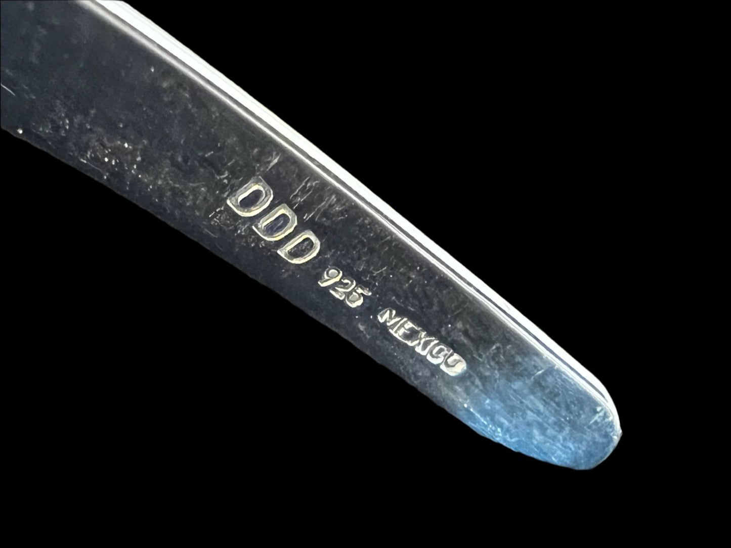 If you're looking for a necklace that embodies individuality, this is it. Crafted from fine sterling silver, this torque necklace has a unique ribbon-like fold as its focal point. This piece is signed "Dominique".