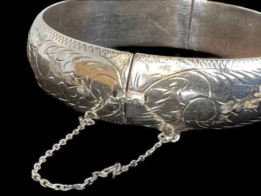 If you're searching for an authentic vintage look, this bracelet is it. Crafted from fine sterling silver, this bracelet has been hand-etched to create a unique design that stretches around the entire bracelet.