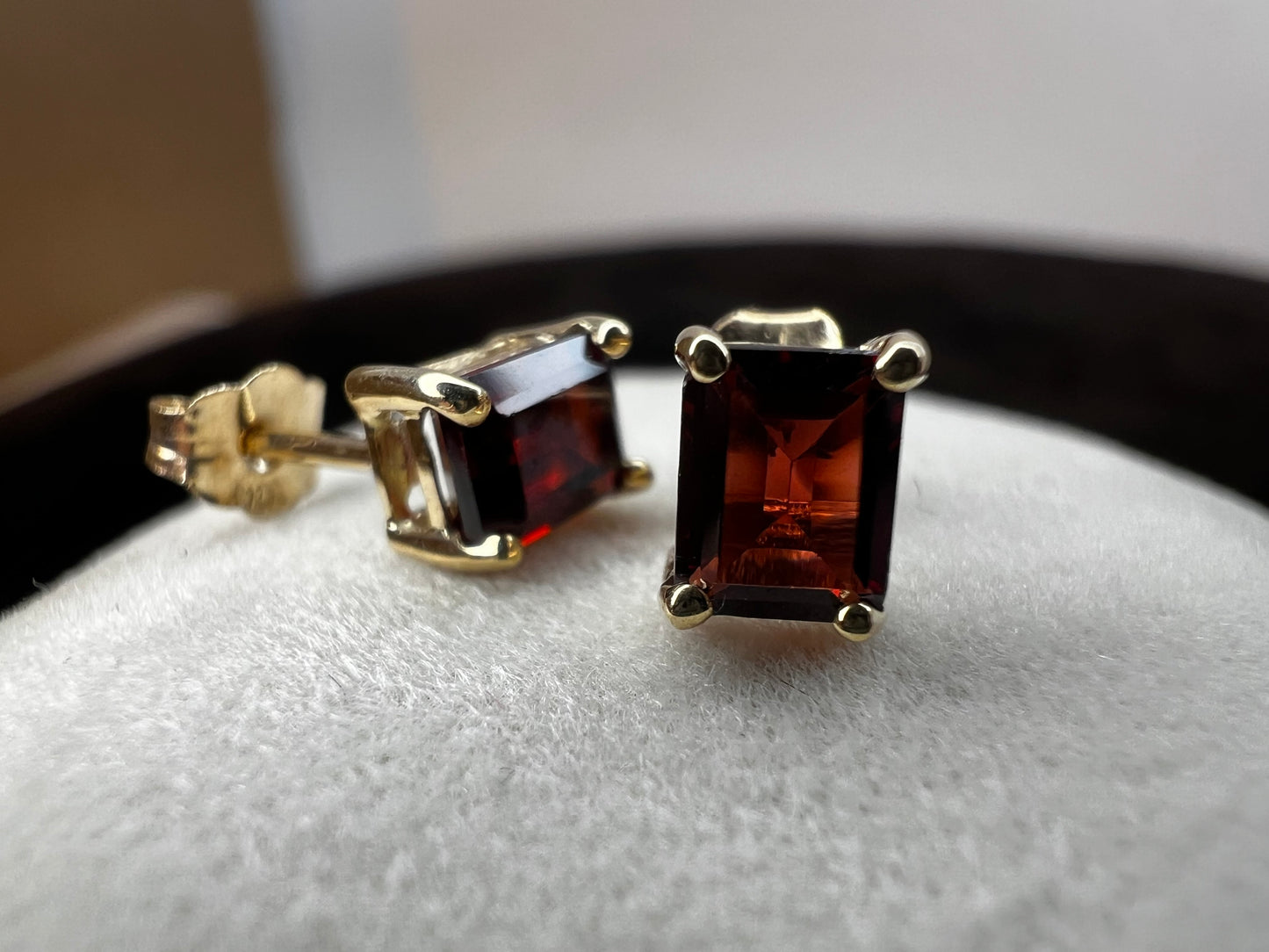 Crafted from 10 karat gold, these earrings feature lovely garnets. They will add a subtle touch of luxury to any outfit.