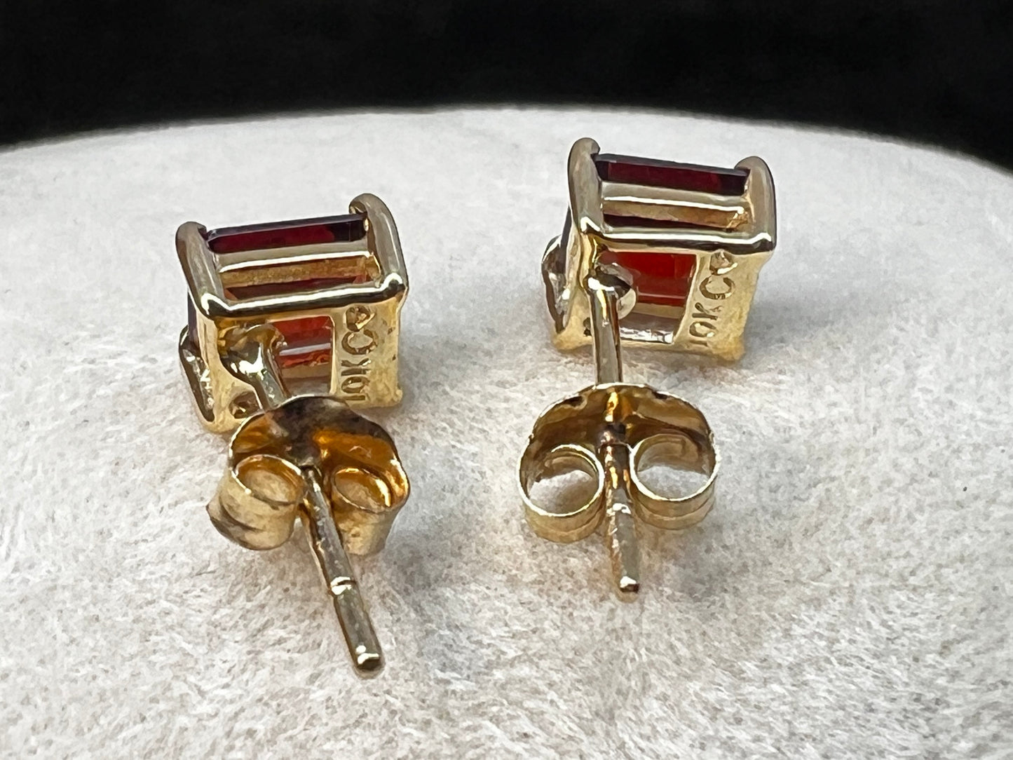 Crafted from 10 karat gold, these earrings feature lovely garnets. They will add a subtle touch of luxury to any outfit.