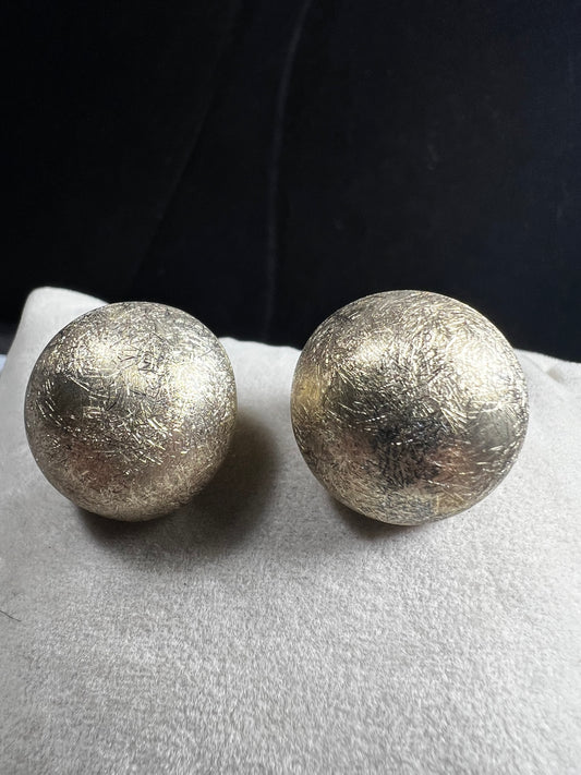 These earrings are crafted from sterling silver with a gold gilt overlay. Made in Italy.