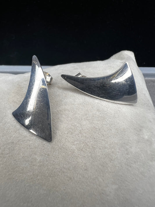 These sterling silver shark fin earrings combine elegant craftsmanship with a nod to oceanic adventure. Perfectly sized for everyday wear, they offer a subtle yet distinctive accessory for beach enthusiasts.