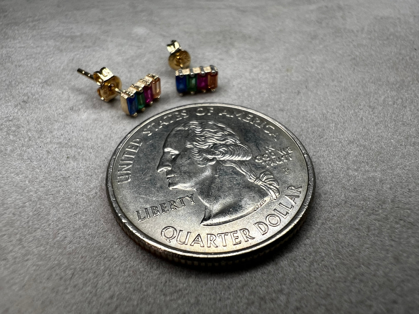 Elevate your everyday look with these stunning sterling silver earrings. They feature vibrant multi-colored stones set against a luxurious gold overlay. The perfect blend of elegance and versatility, these earrings add a pop of color and sophistication to any outfit. Crafted with quality materials, they're ideal for both casual wear and special occasions.