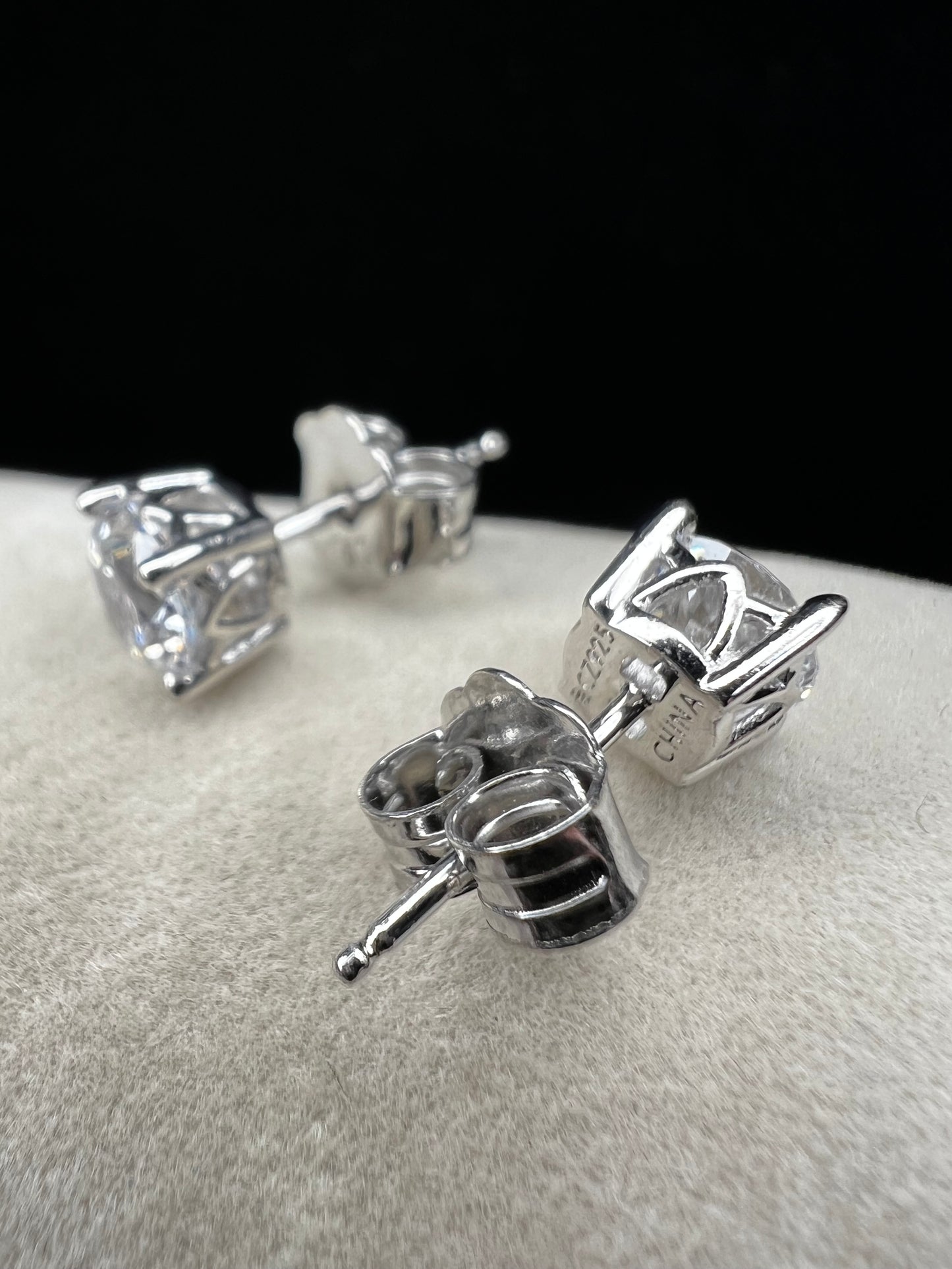 These sterling silver and CZ earrings combine timeless elegance with modern sparkle. Each piece features a generous 6 mm cubic zirconia stone set in premium sterling silver, delivering brilliant shine at a fraction of the cost of diamonds. Perfect for everyday wear or special occasions, these earrings offer versatile style that complements any wardrobe.