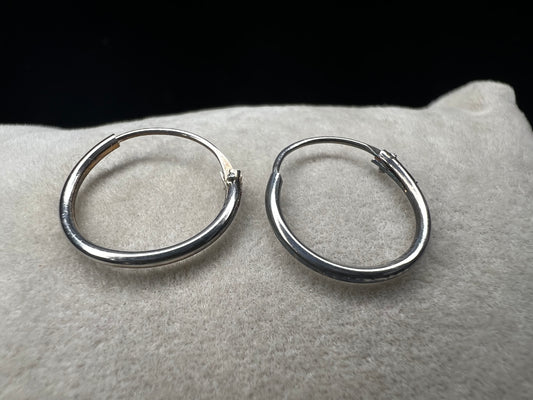 These hoop earrings offer a timeless and refined accessory choice. Crafted from high-quality sterling silver, they provide durability and a polished finish that complements any outfit.