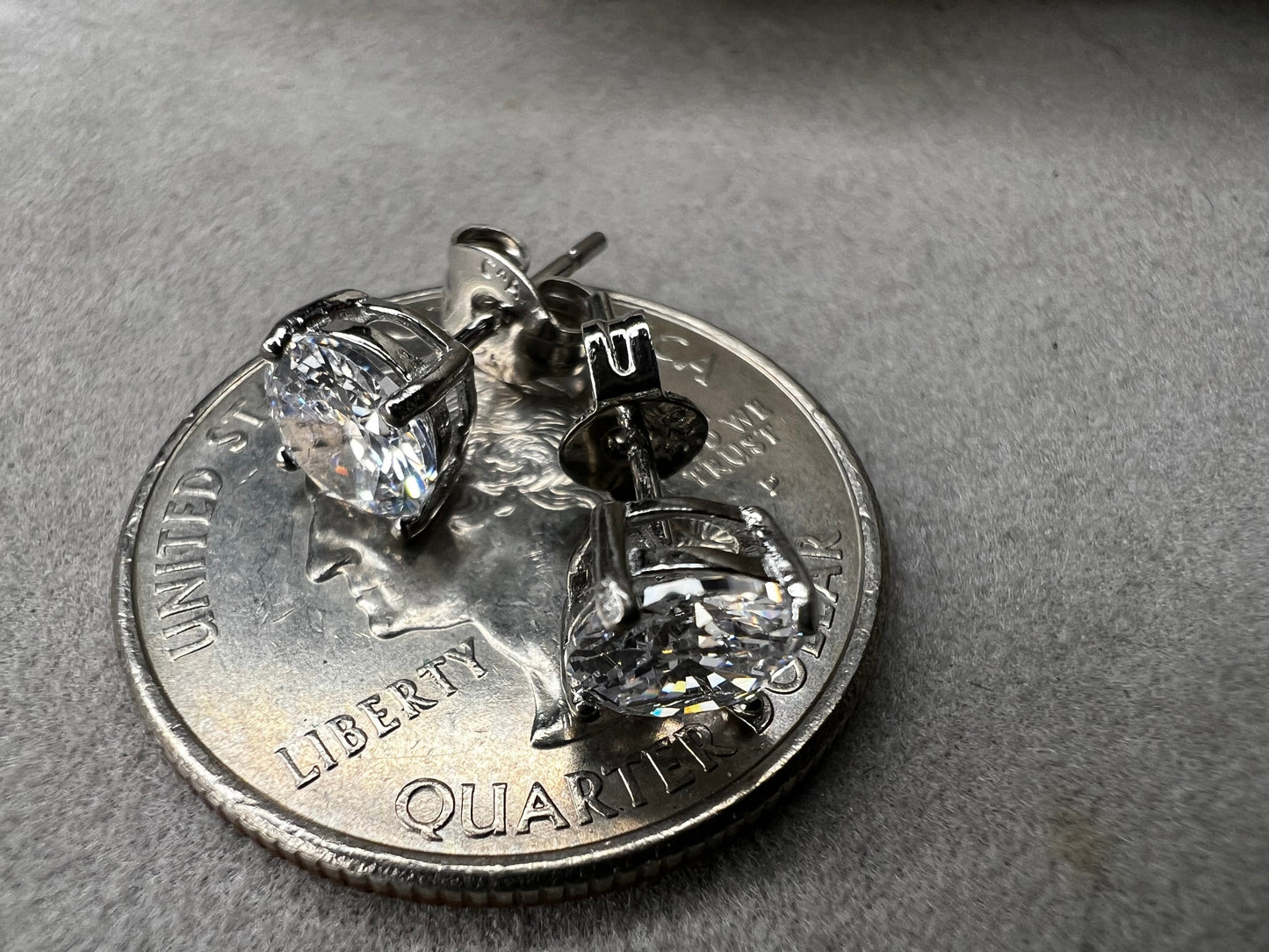 Elevate your everyday look with these timeless sterling silver 6 mm CZ stud earrings. Each pair features brilliant cubic zirconia stones that sparkle with diamond-like clarity. The perfect size for versatile wear ... understated enough for the office, radiant enough for special occasions.