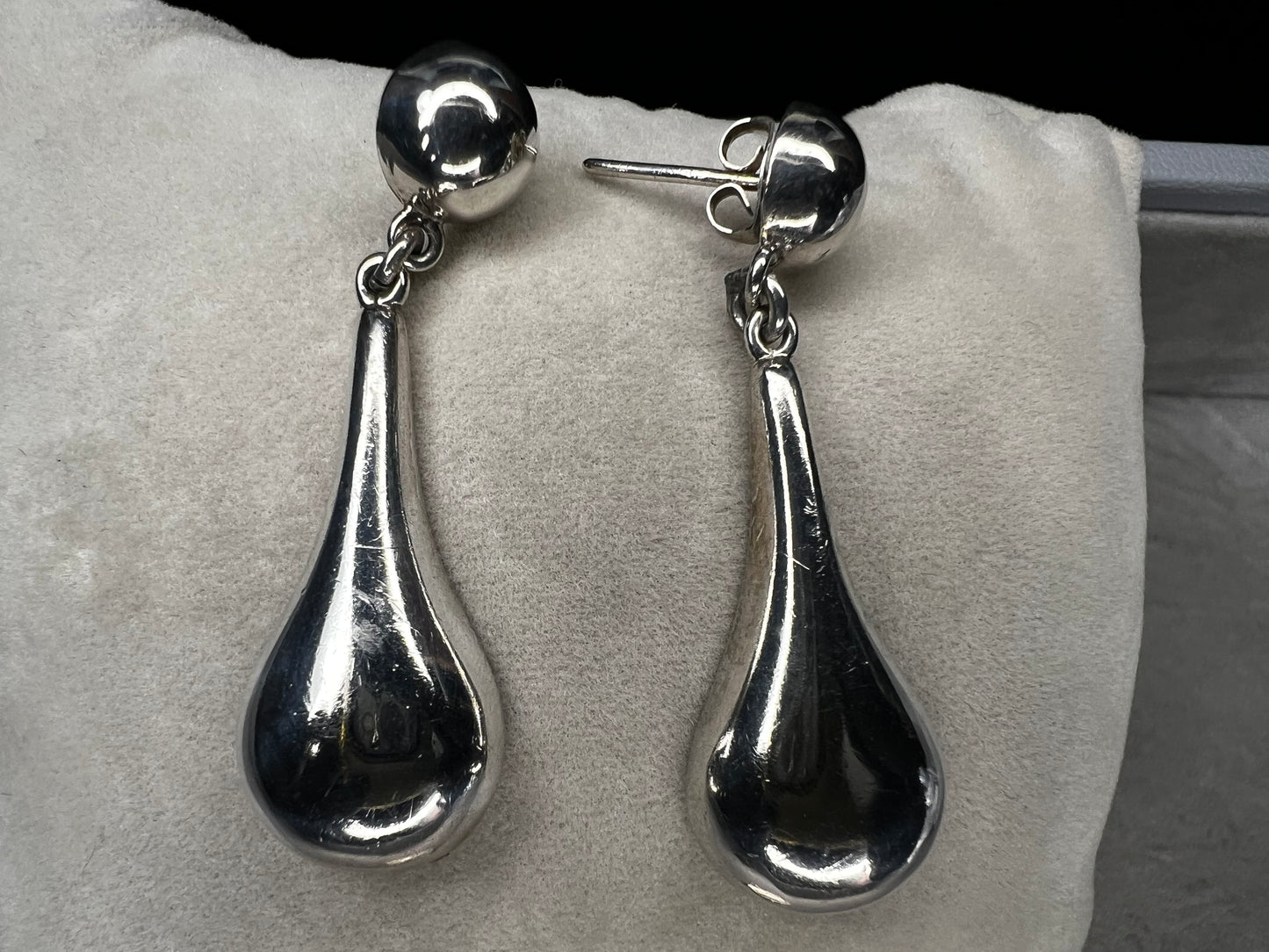 These vintage earrings showcase authentic Taxco craftsmanship, featuring sterling silver with distinctive hallmarks. Designed with elegant ball studs and graceful teardrop shapes, they offer a timeless accessory that reflects expert artistry and quality.
