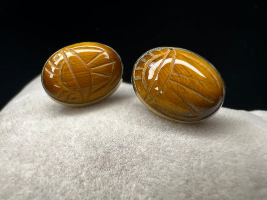 These gold-filled earrings showcase tiger's eye scarabs, combining timeless elegance with natural beauty. The warm tones of tiger's eye add depth and sophistication, making these a versatile accessory that enhances both casual and formal looks.