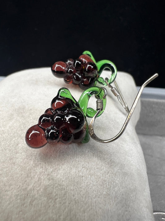 This is a great little pair of earrings. They feature glass grapes with sterling silver hooks.