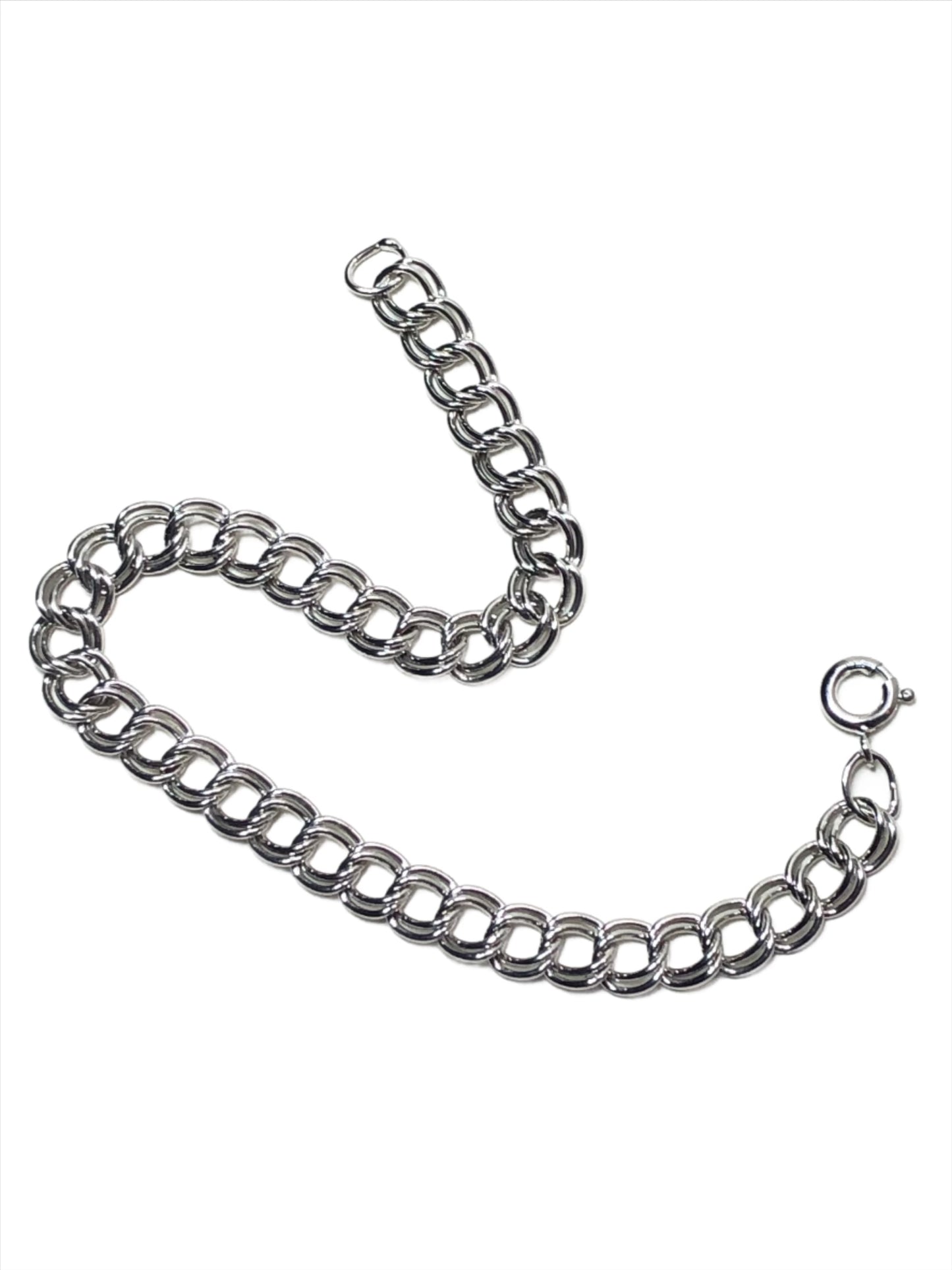 This beautiful sterling silver bracelet features a classic double-link design. It is perfect for daily wear or can provide a touch of elegance when paired with formal attire. And, of course, it's a fresh canvas if you want to personalize it with your favorite charms.