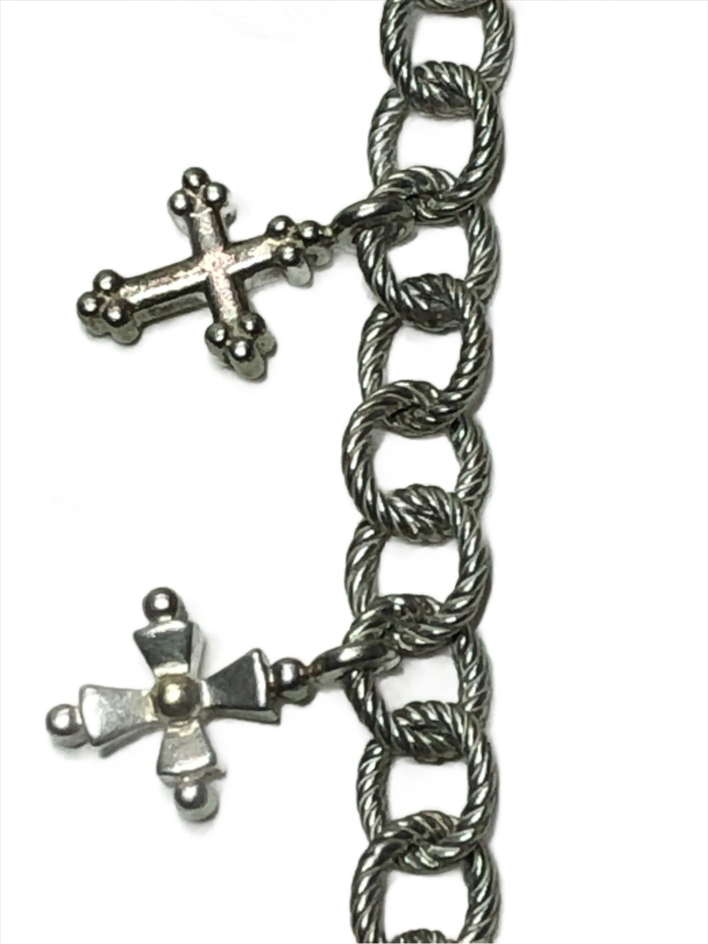 Elevate your style with this Ann King sterling silver charm bracelet. It features five detailed silver crosses, three of which are accented with luxurious 18k gold. This piece is perfect for adding a touch of faith and elegance to any outfit.