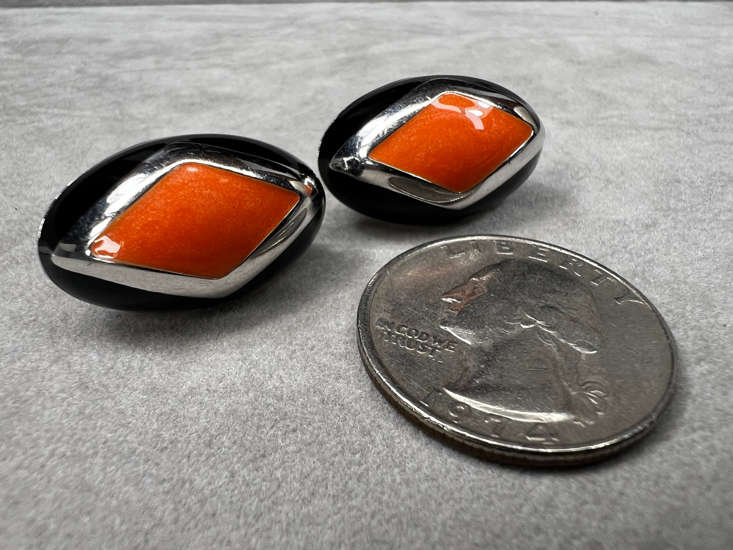 Add a vibrant touch to your collection with these vintage Italian earrings. Crafted from sterling silver, they feature striking orange and black inlay.