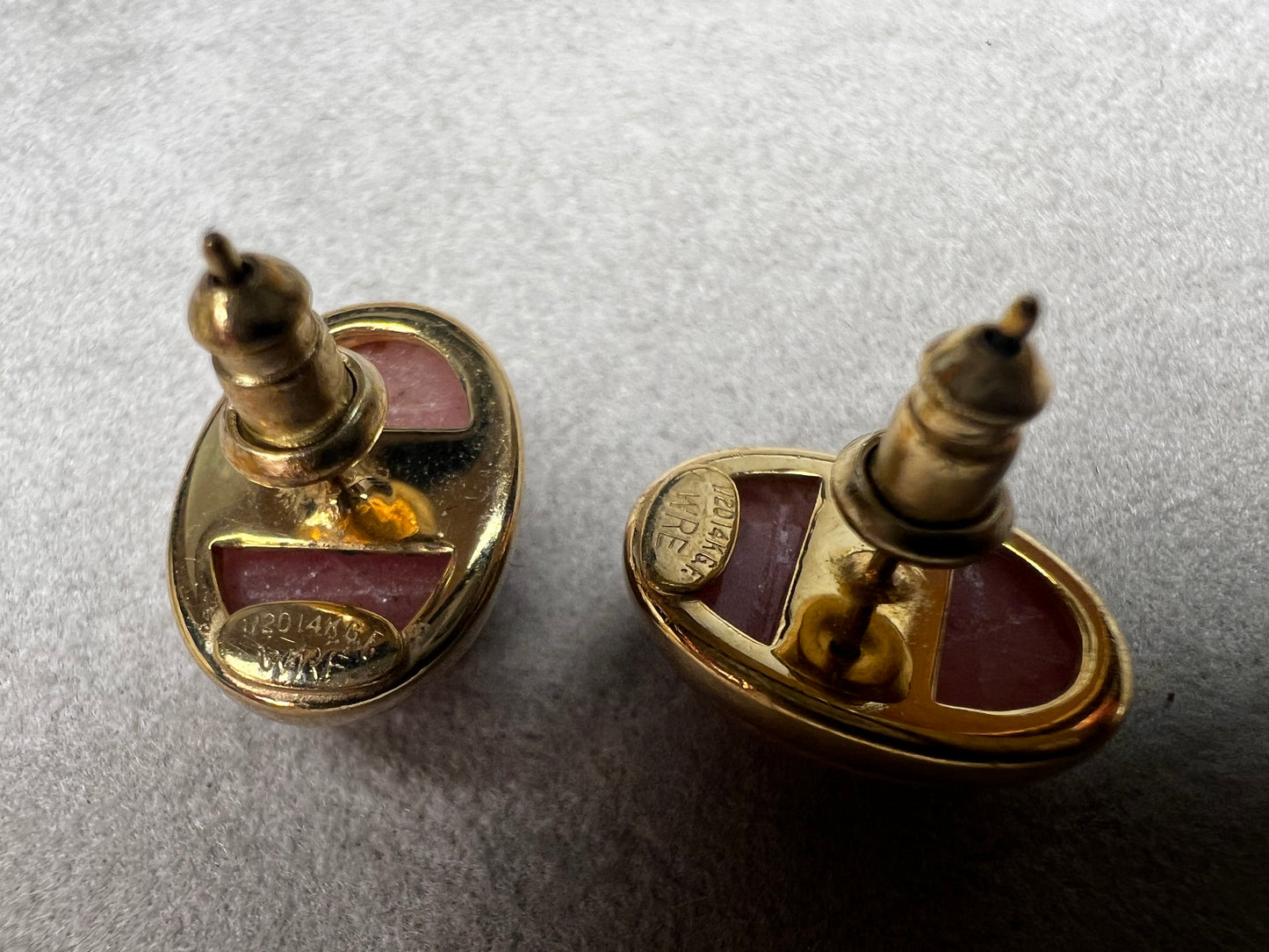 These carved scarab stones, likely pink aventurine, are set in warm 14 karat gold-filled settings and crafted into a timeless pair of post earrings.