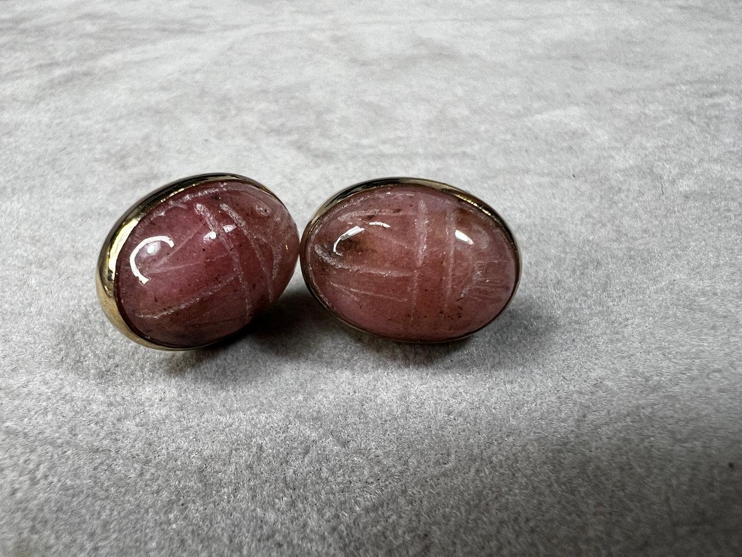 These carved scarab stones, likely pink aventurine, are set in warm 14 karat gold-filled settings and crafted into a timeless pair of post earrings.