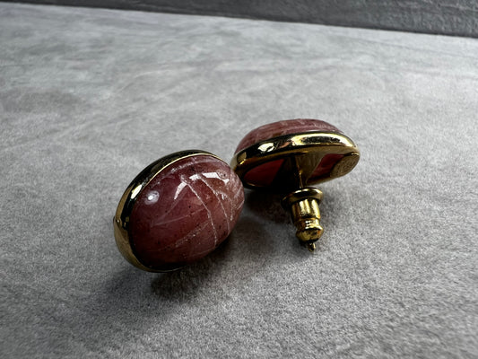 These carved scarab stones, likely pink aventurine, are set in warm 14 karat gold-filled settings and crafted into a timeless pair of post earrings.