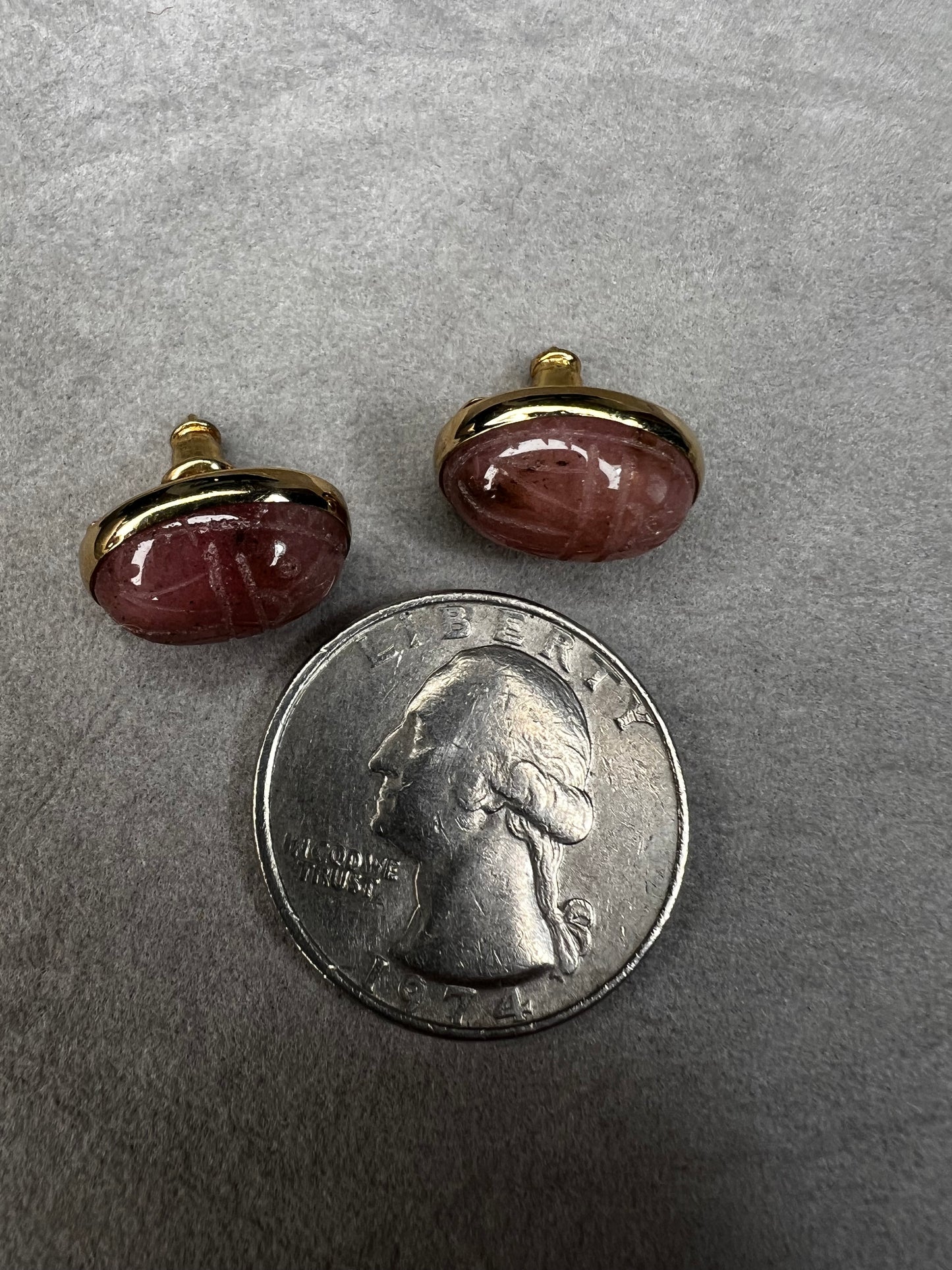 These carved scarab stones, likely pink aventurine, are set in warm 14 karat gold-filled settings and crafted into a timeless pair of post earrings.