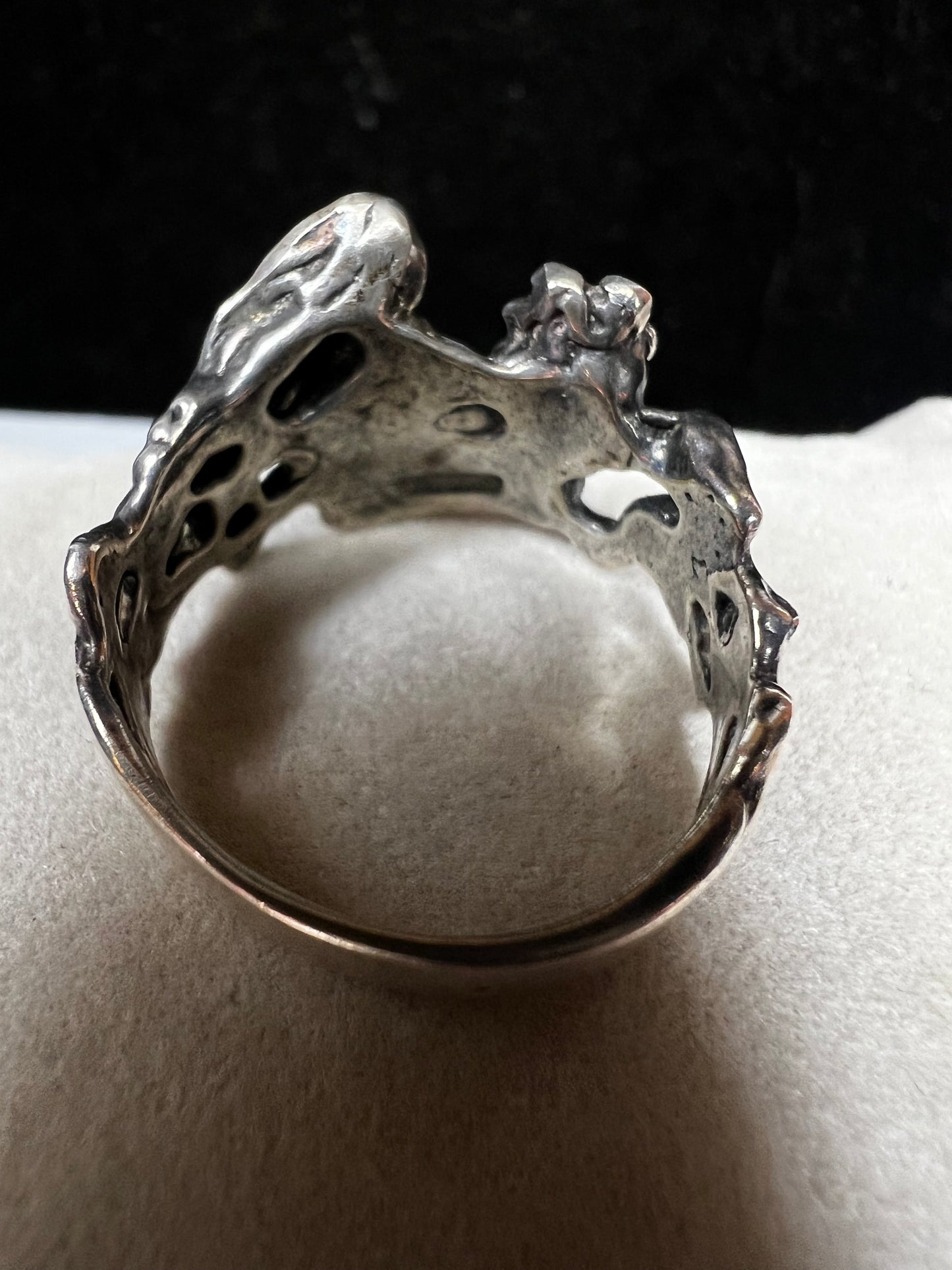 This sterling silver "lady in a dress" ring showcases expert craftsmanship with its solid construction. Its refined design captures a timeless aesthetic, making it a sophisticated addition to any jewelry collection. Perfect for those who appreciate quality and artistry in their accessories.
