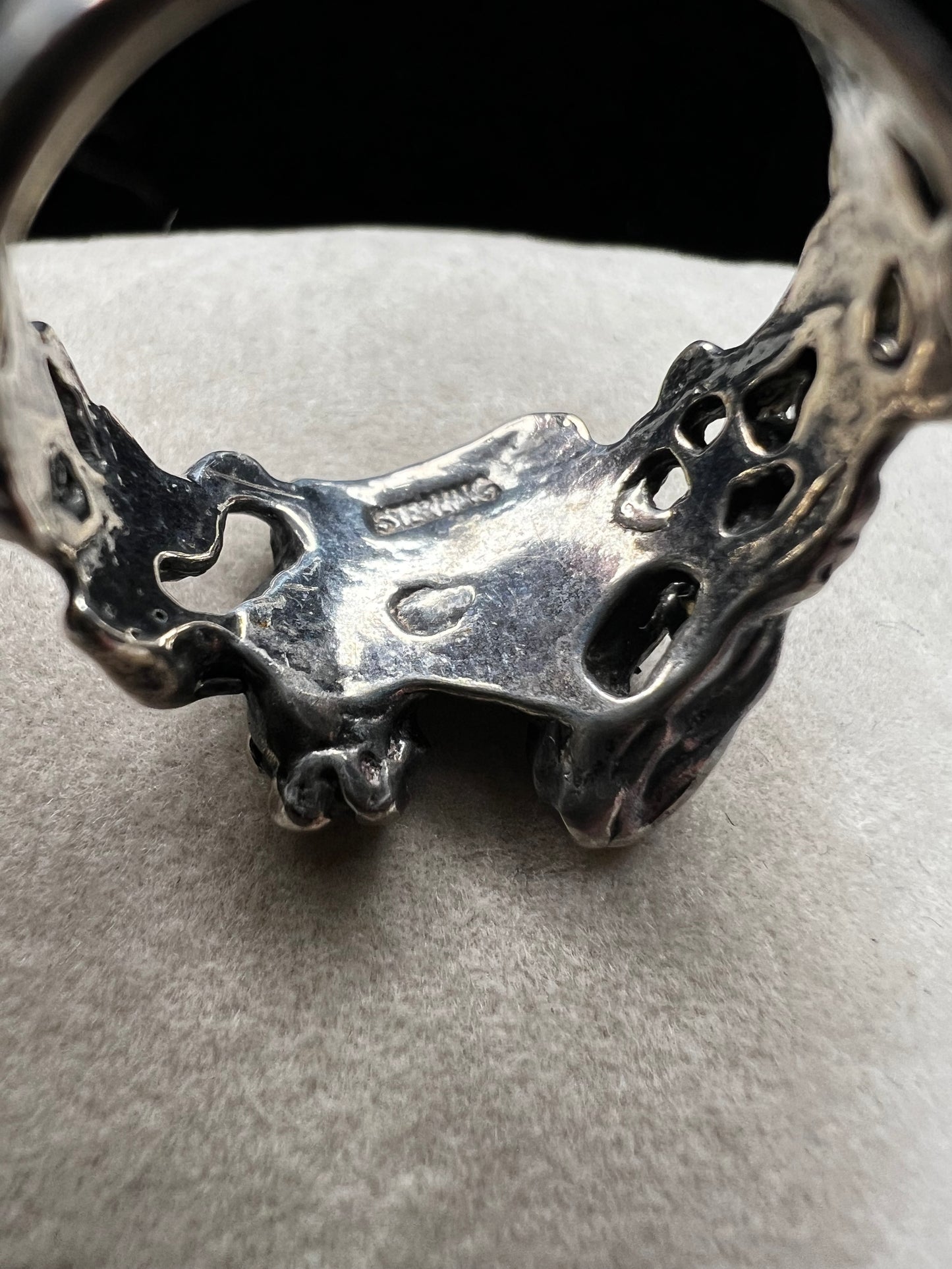 This sterling silver "lady in a dress" ring showcases expert craftsmanship with its solid construction. Its refined design captures a timeless aesthetic, making it a sophisticated addition to any jewelry collection. Perfect for those who appreciate quality and artistry in their accessories.