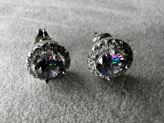 Accented with a halo of sparkling cubic zirconia, these sterling silver earrings frame their mystic quartz centers with brilliant light-catching detail.