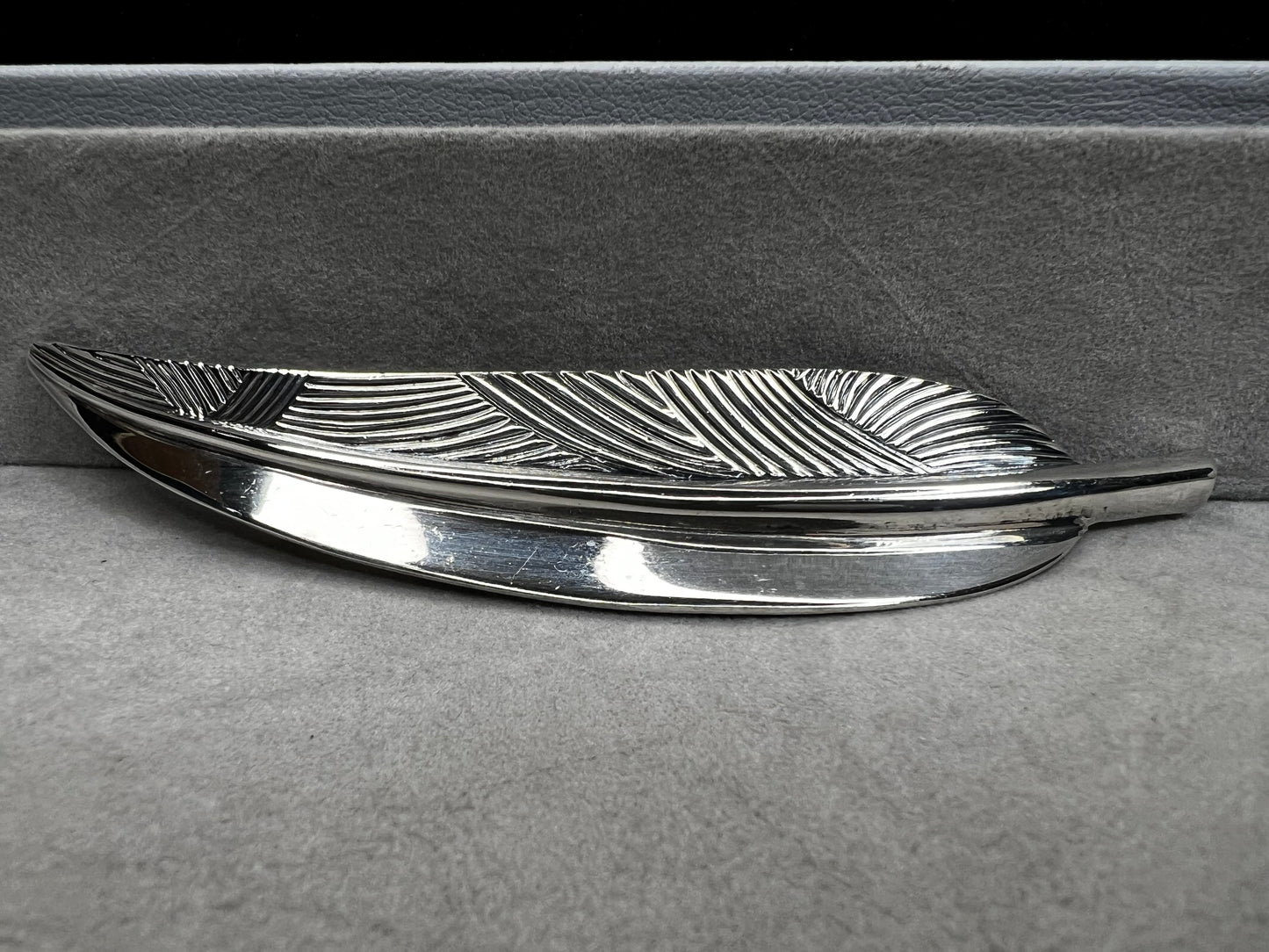 This Danecraft sterling silver brooch features an elegant leaf design measuring just over 4 inches, making it a standout accessory.