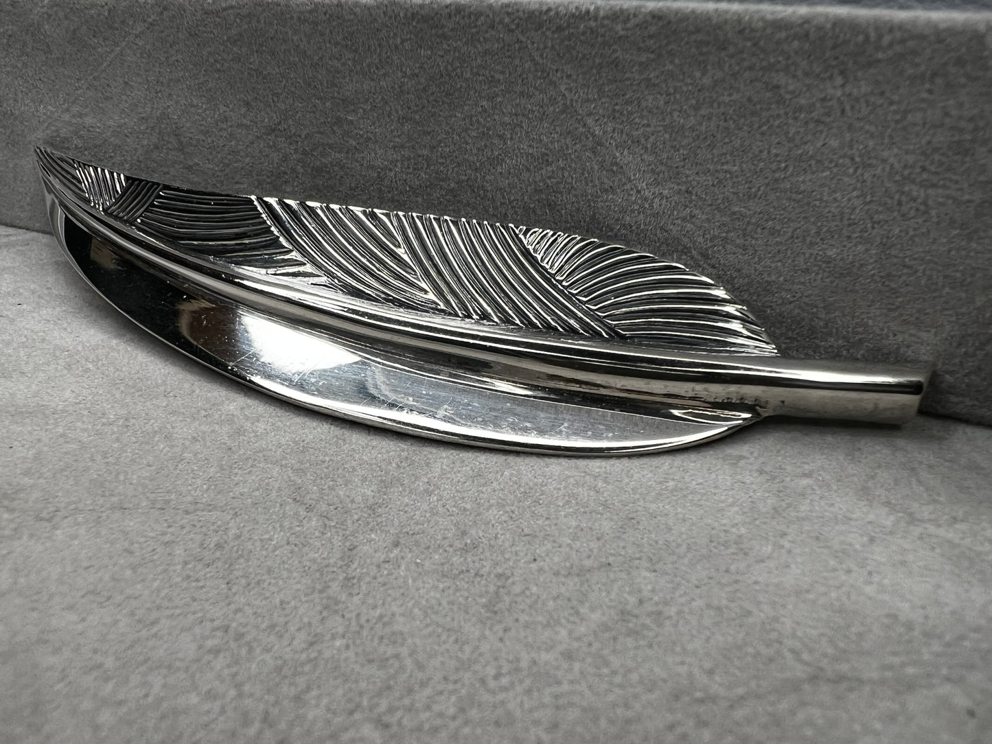 This Danecraft sterling silver brooch features an elegant leaf design measuring just over 4 inches, making it a standout accessory.