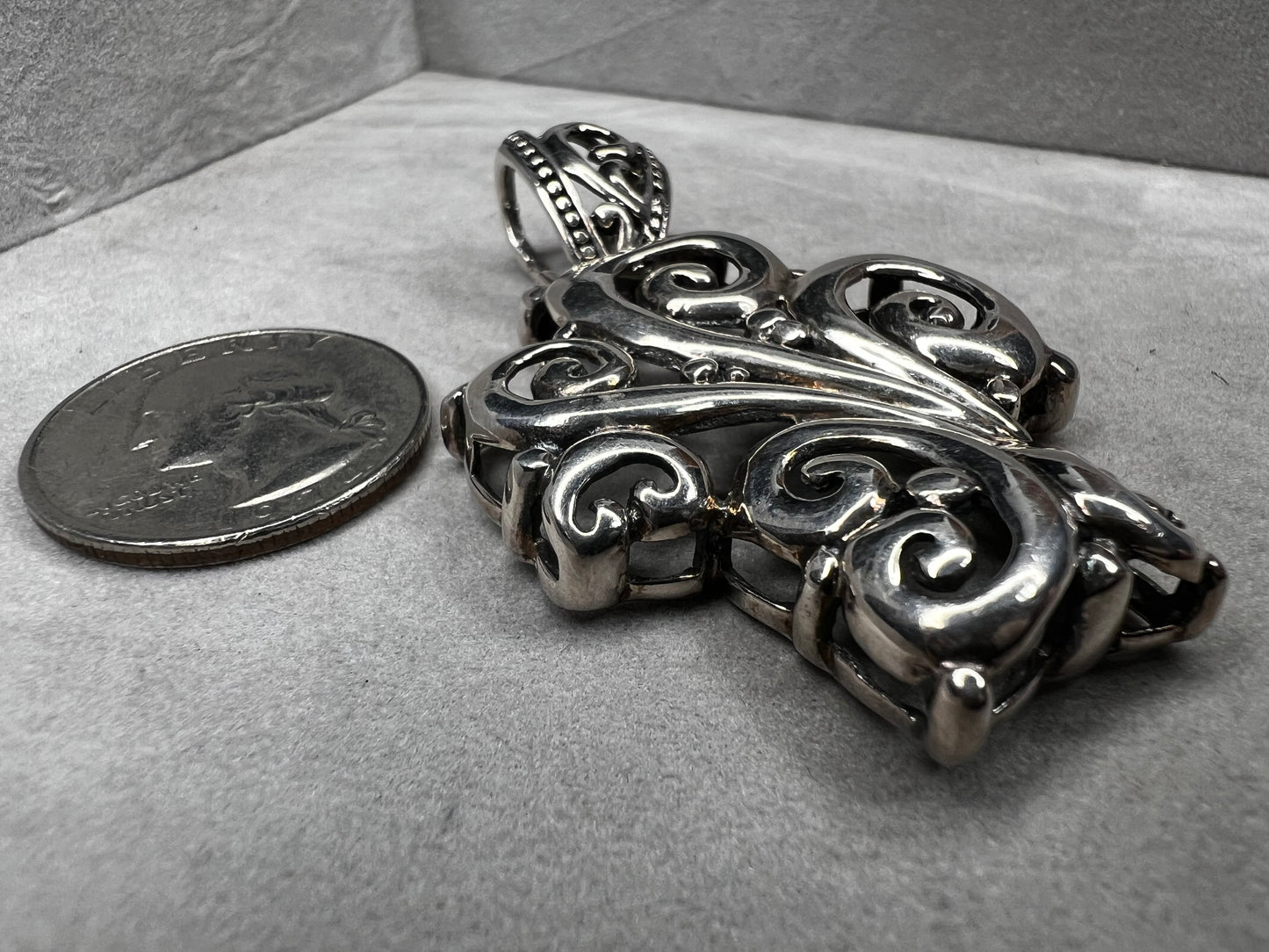 This large 2.5" sterling silver crucifix pendant combines boldness with elegance in its detailed craftsmanship. Its striking design makes it a meaningful statement piece, perfect for expressing faith with style and confidence.