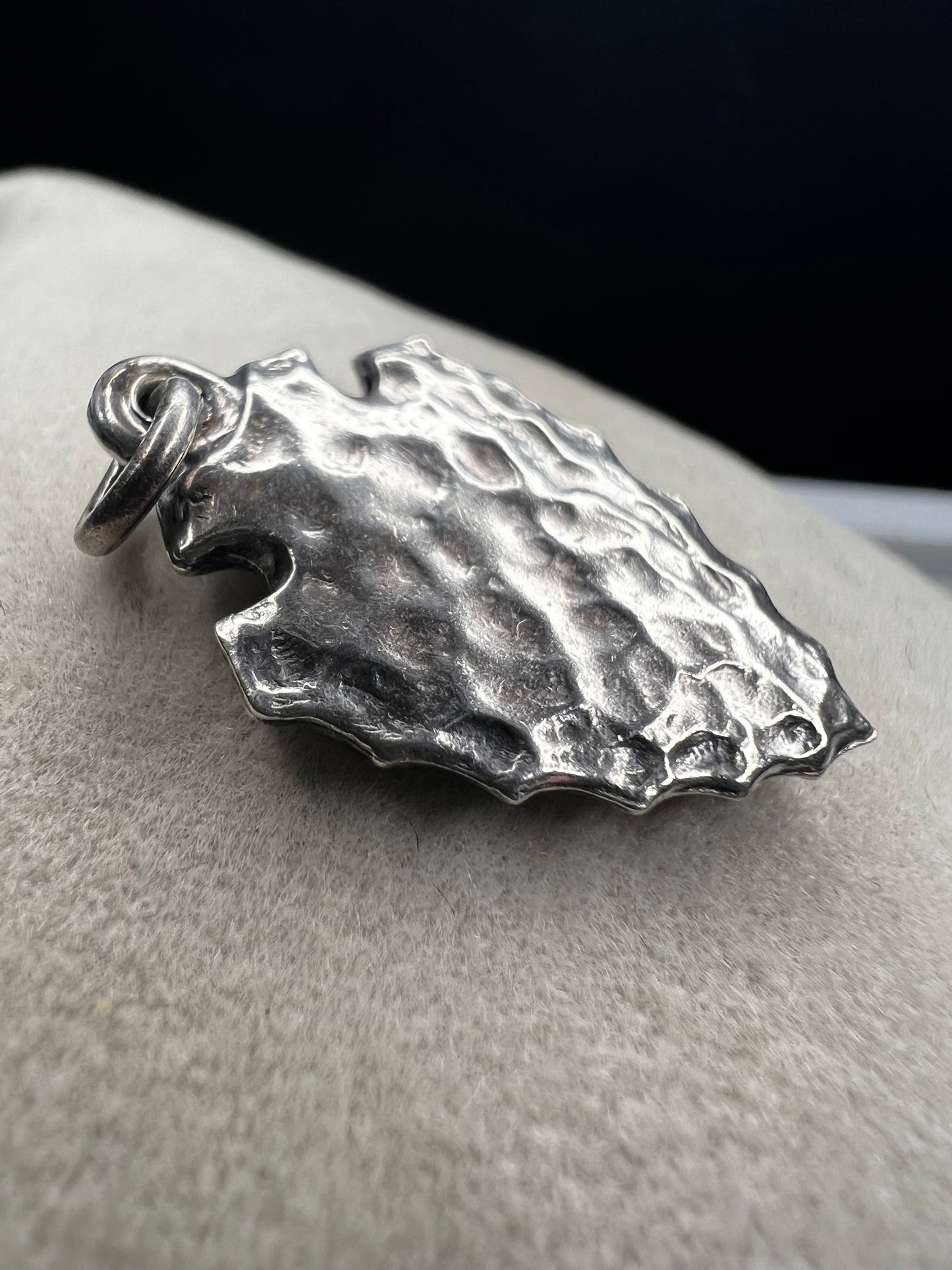 This sterling silver arrowhead, measuring 1 inch, offers versatile wear as either a charm or a pendant. Its sleek design adds a subtle touch of elegance, making it a meaningful accessory that complements any style with ease.