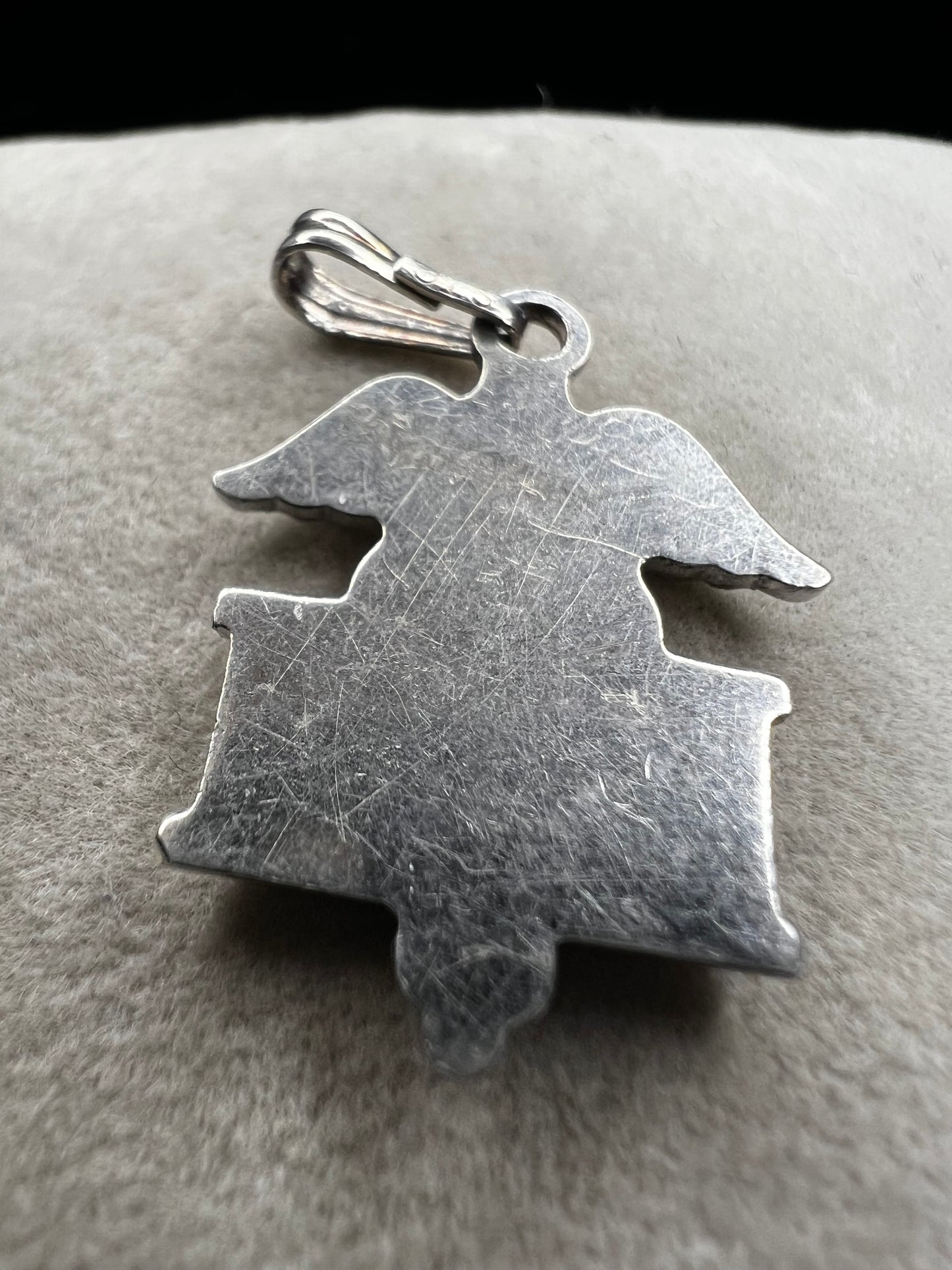 Celebrate the dedication of nurses with this vintage sterling silver RN pendant. It serves as a meaningful symbol of commitment and care. Perfect for everyday wear or as a thoughtful gift.