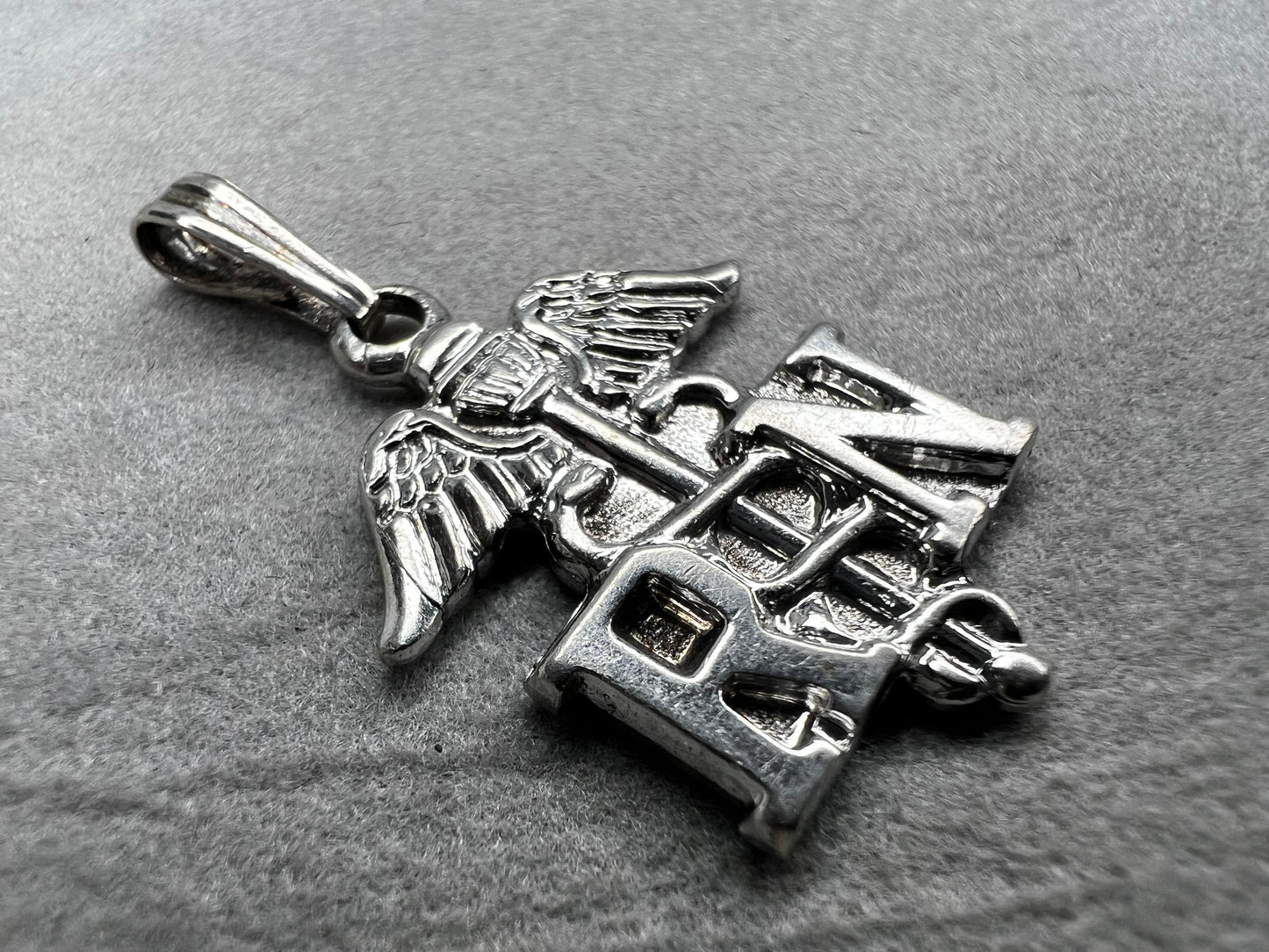 Celebrate the dedication of nurses with this vintage sterling silver RN pendant. It serves as a meaningful symbol of commitment and care. Perfect for everyday wear or as a thoughtful gift.