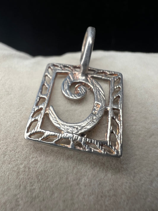This sterling silver pendant features an elegant open work design with delicate diamond cuts, adding a refined touch to the classic "C" initial.