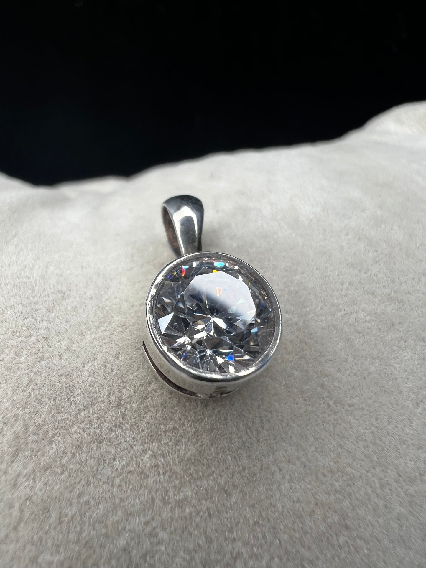 This petite pendant showcases a tourmaline set in sterling silver, offering a subtle yet elegant touch of class. Its delicate size makes it perfect for layering or wearing alone, and it pairs well with our small sterling chains.
