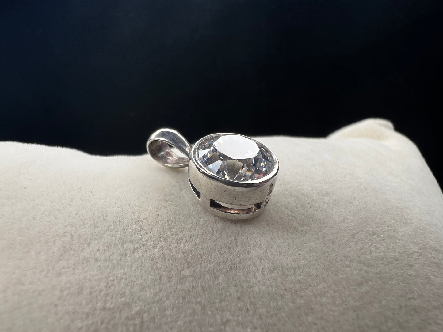 This petite pendant showcases a tourmaline set in sterling silver, offering a subtle yet elegant touch of class. Its delicate size makes it perfect for layering or wearing alone, and it pairs well with our small sterling chains.
