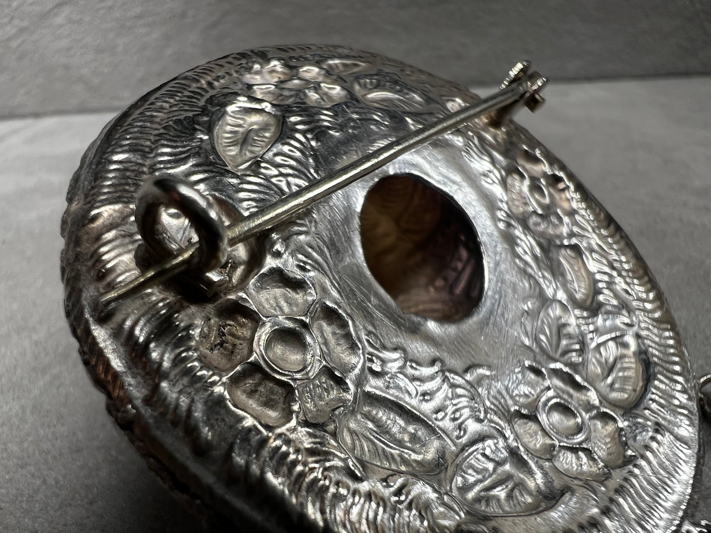 This charming 1950s sterling silver brooch captures a playful scene with a large sombrero, a pair of sandals, and a maraca. Its unique design reflects vintage character and cultural flair, making it a delightful accessory that adds personality and nostalgia to your collection.
