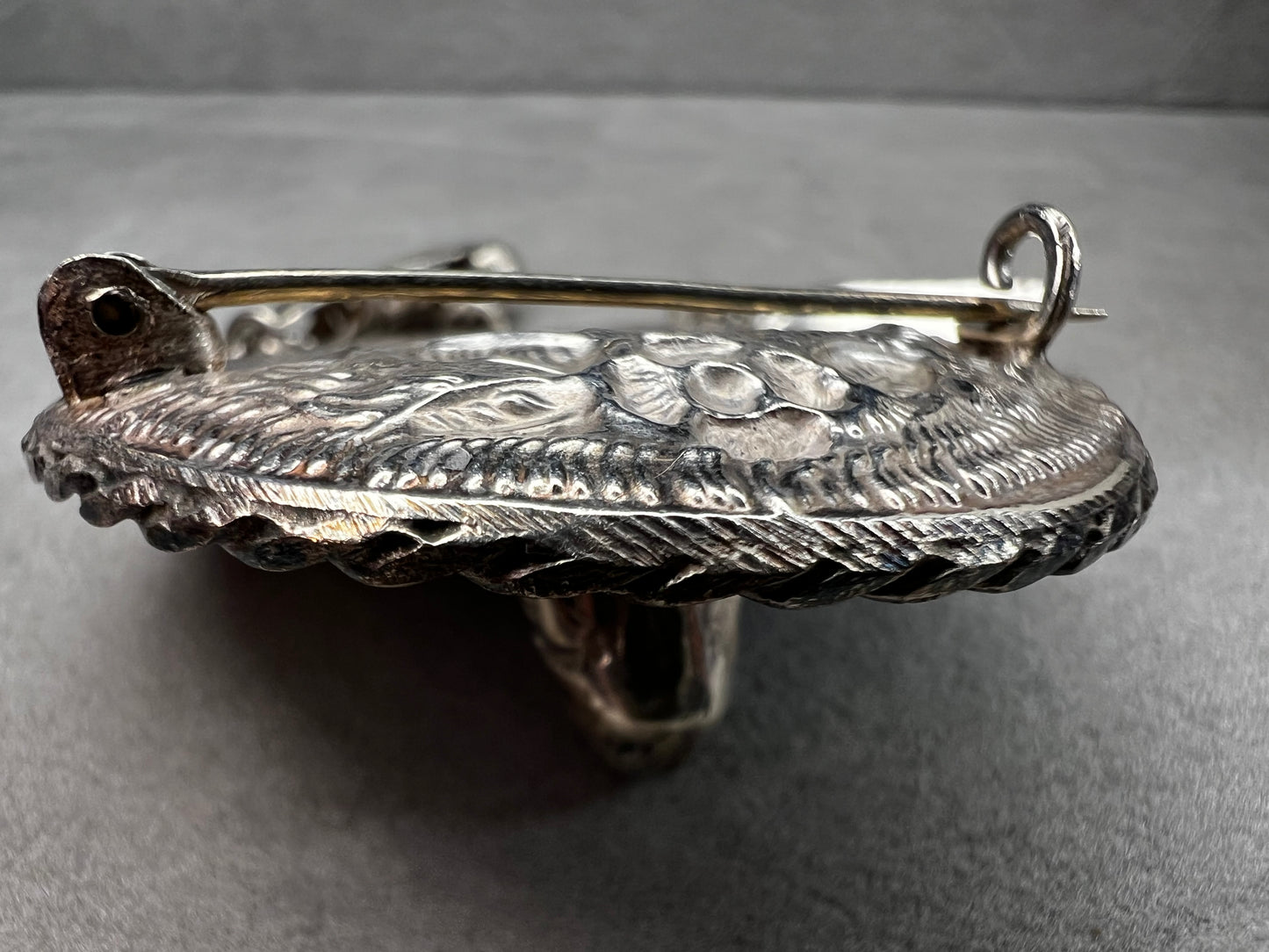 This charming 1950s sterling silver brooch captures a playful scene with a large sombrero, a pair of sandals, and a maraca. Its unique design reflects vintage character and cultural flair, making it a delightful accessory that adds personality and nostalgia to your collection.