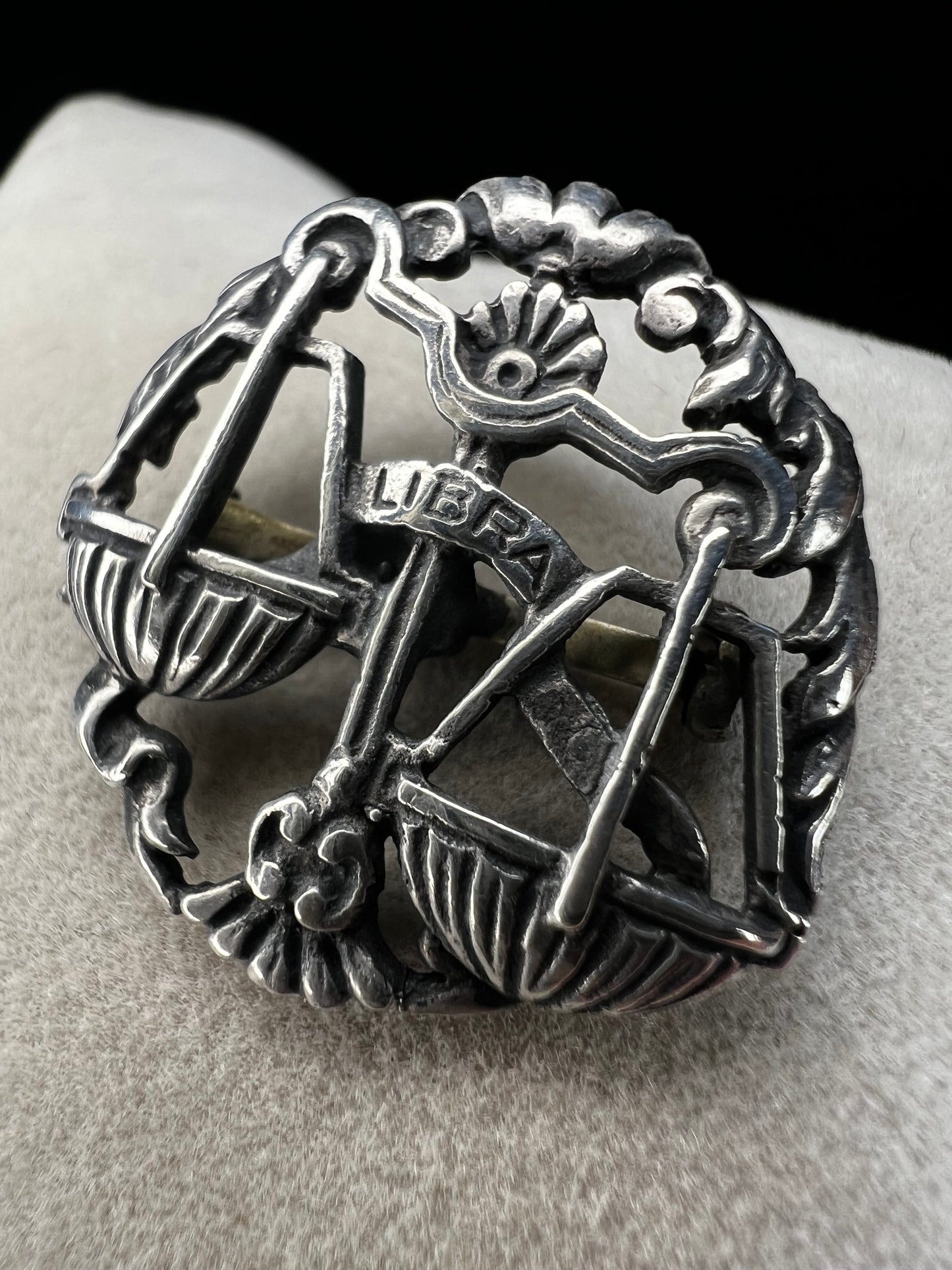 Celebrate the charm of the Libra zodiac sign with this vintage sterling silver brooch. Its timeless design makes it a thoughtful gift for anyone who appreciates astrology.