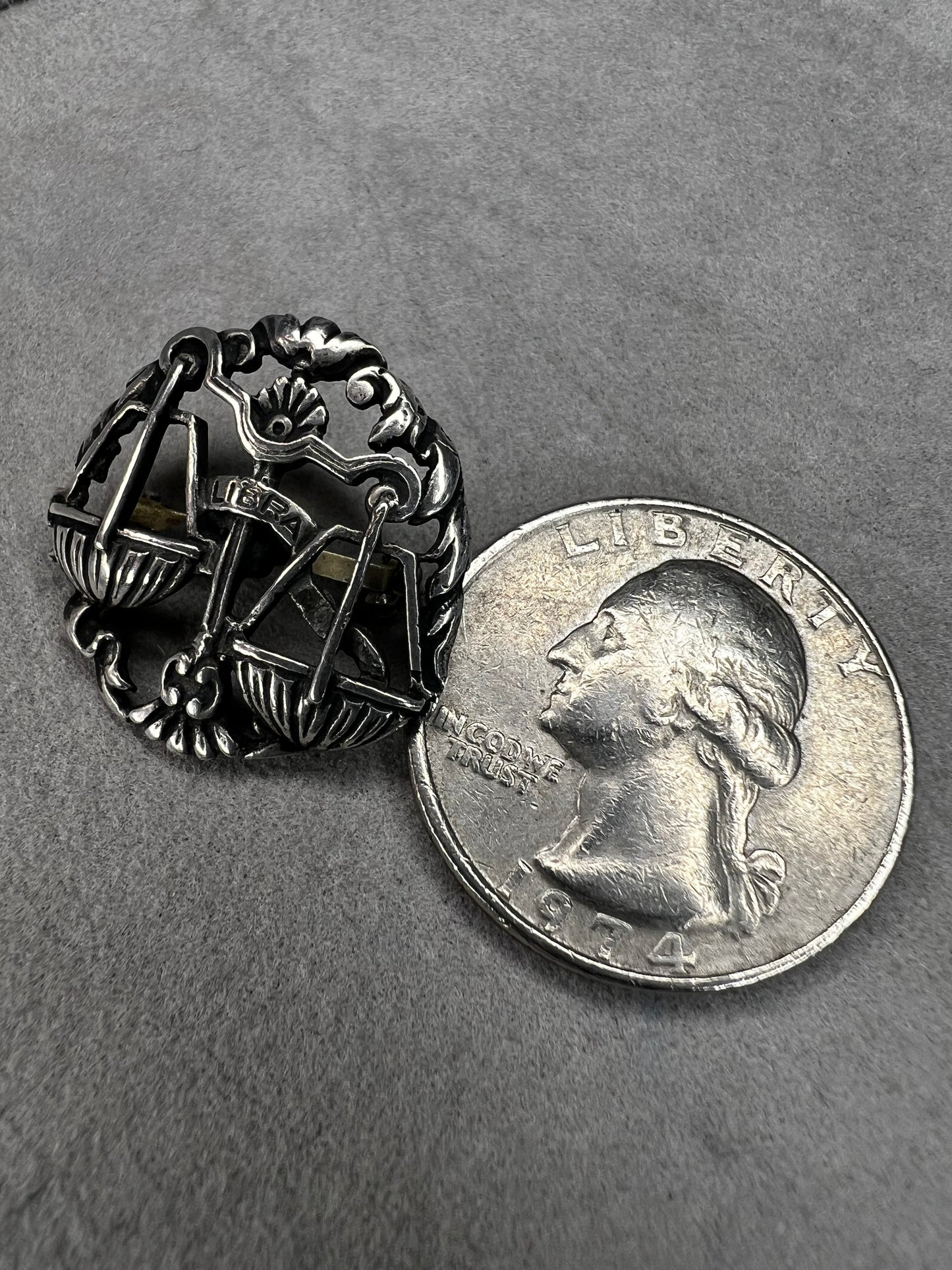 Celebrate the charm of the Libra zodiac sign with this vintage sterling silver brooch. Its timeless design makes it a thoughtful gift for anyone who appreciates astrology.