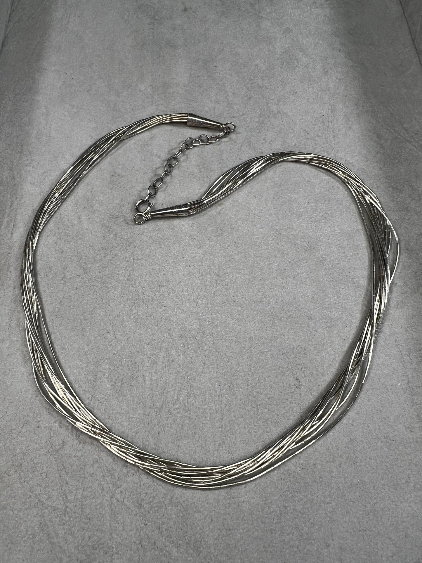 This 18-inch sterling silver "Liquid Sterling" necklace features 10 delicate strands that move gracefully with you, capturing and reflecting light beautifully.