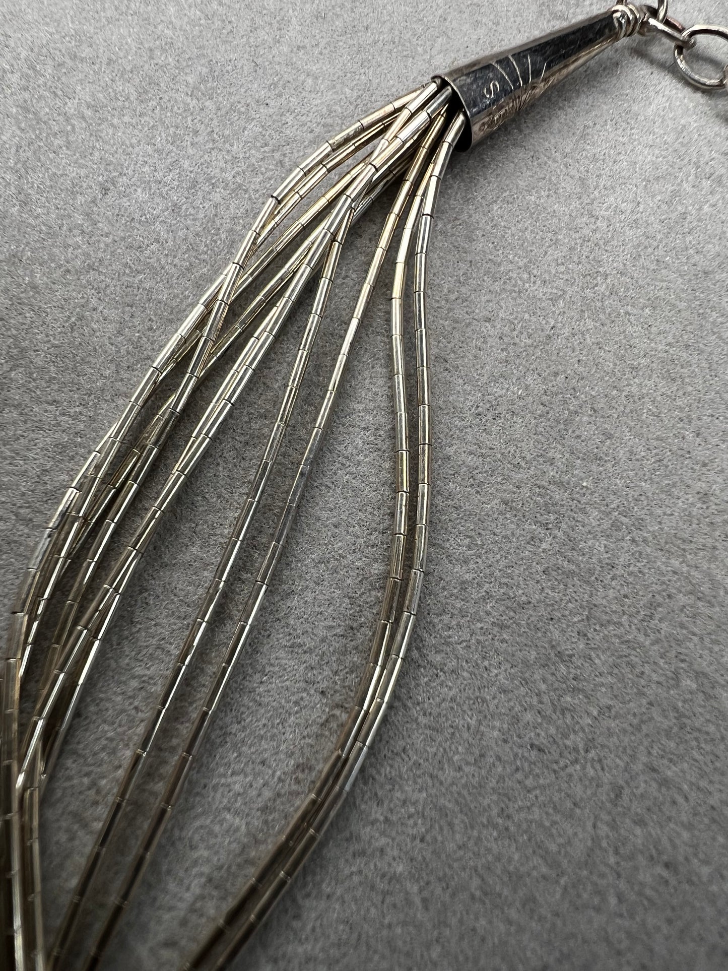 This 18-inch sterling silver "Liquid Sterling" necklace features 10 delicate strands that move gracefully with you, capturing and reflecting light beautifully.