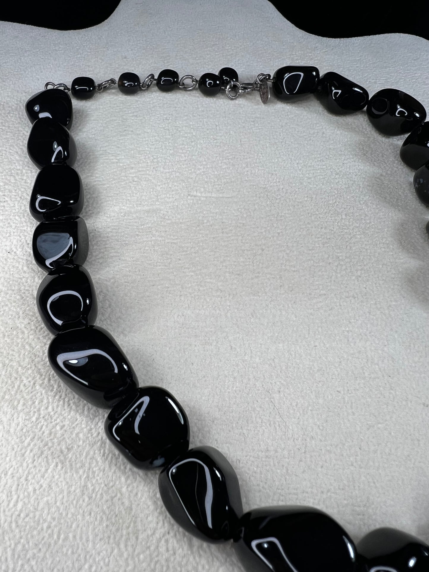 This necklace from LSB Designs features natural black onyx beads and sterling silver, combining striking beauty with lasting durability. Designed to impress, it offers a bold yet elegant accessory that enhances any look.