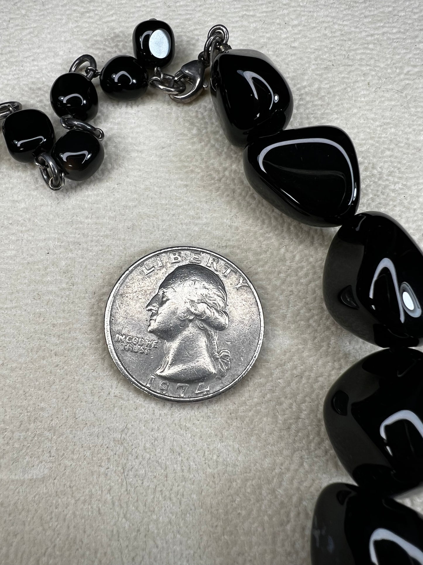 This necklace from LSB Designs features natural black onyx beads and sterling silver, combining striking beauty with lasting durability. Designed to impress, it offers a bold yet elegant accessory that enhances any look.