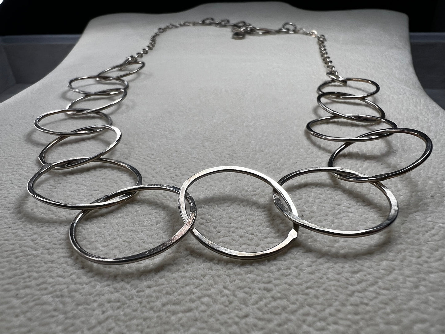 This 20" sterling silver ring and link necklace is thoughtfully crafted to add a touch of elegance and confidence to your favorite outfits. Let this necklace be the special piece that completes your wardrobe with grace and charm.