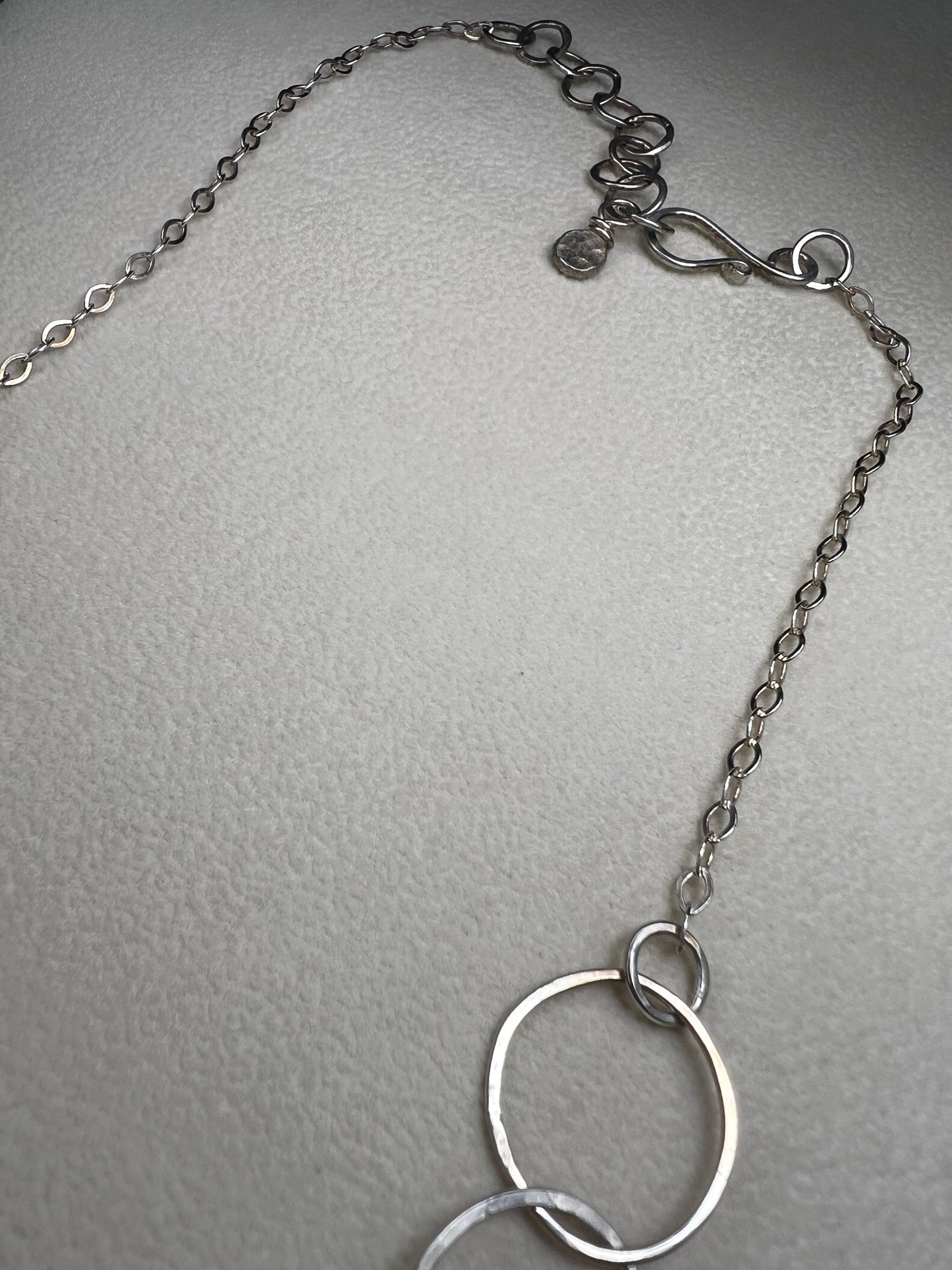 This 20" sterling silver ring and link necklace is thoughtfully crafted to add a touch of elegance and confidence to your favorite outfits. Let this necklace be the special piece that completes your wardrobe with grace and charm.