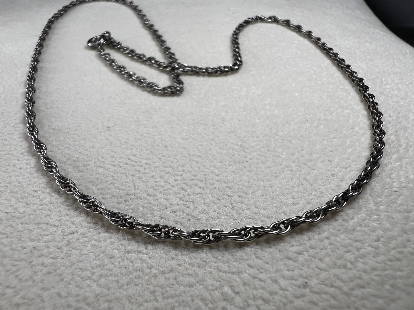 This vintage classic sterling silver 18" rope chain offers a subtle touch of timeless style. Its delicate design works beautifully on its own or as a perfect complement to one of our pendants.